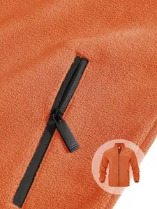 Close-up detail of orange fleece jacket showing zipper and soft textured polar fleece fabric