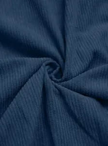 Close-up detail of heavy navy blue corduroy fabric showing rich texture and fine ribs.