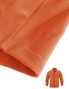Detail view of the soft orange fleece fabric texture on a men's outdoor jacket