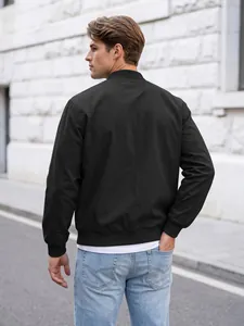 Back view detail of a men's solid black bomber jacket with ribbed collar and hem.