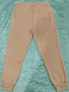Detailed back view of khaki men's joggers with elastic waistband and single rear pocket