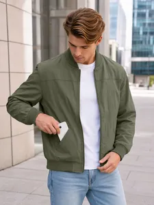 Detailed view of functional side pocket on classic olive green bomber jacket for men