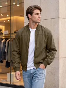 Men's olive green bomber jacket detail with zipper and side pockets on model