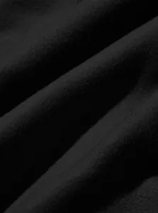 Macro detail view of high-quality black fabric texture for men's casual cargo jogger pants