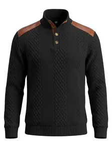Detailed view of black men's cable-knit sweater with brown leather shoulder patches.