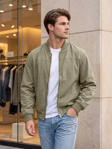 Detailed view of a men's olive green bomber jacket featuring ribbed cuffs and side pockets