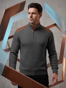 Detailed view of men's textured knit sweater with brown leather shoulder patches