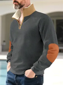 Detail of men's retro half-zip sweatshirt with elbow patches and fleece-lined collar