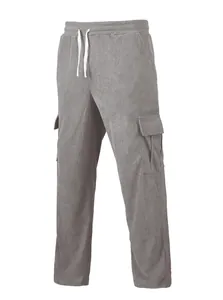 Detailed shot of grey corduroy cargo pants featuring side pockets and white drawstring waist