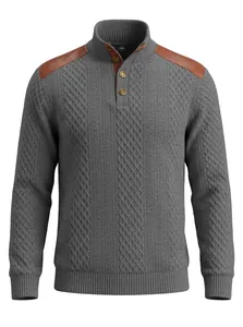 Detailed view of grey cable-knit men's sweater with brown leather shoulder patches