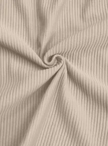 Macro shot of breathable beige ribbed fabric for men's casual wide-leg trousers
