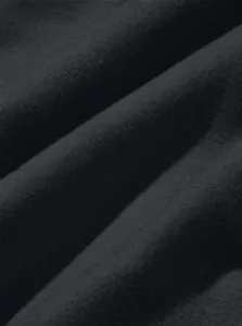Detailed macro shot showing the soft texture of black fabric for men's cargo drawstring pants