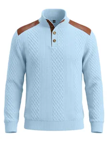 Detail view of light blue cable knit sweater with brown shoulder patches and button collar