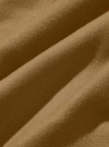 Close-up of soft brown fleece fabric showing fine brushed texture and material quality.