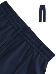 Macro detail view of elastic waistband and drawstring on navy blue sweatpants