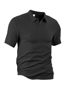 Detailed view of men's black polo shirt with unique herringbone waffle jacquard texture
