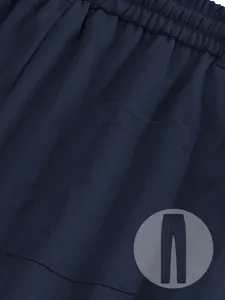 Close-up of navy blue men's casual pants showing twill fabric and elastic waist