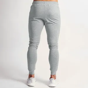 Detailed back view of men's grey slim fit running joggers showing fabric and athletic cut