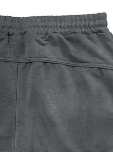 Detailed view of the durable elastic waistband and premium stitching on gray joggers
