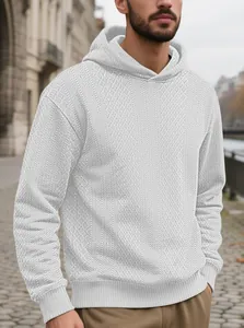 Close-up detail of white jacquard textured men's hooded sweatshirt for casual autumn style