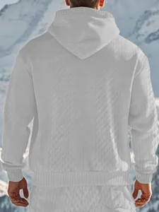 Rear view of men's white hooded sweatshirt with jacquard texture in snow mountains.