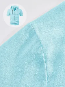 Macro detail showing light blue linen fabric texture of men's short sleeve hooded shirt