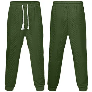 Pantaloni sportivi da uomo verde oliva con texture jacquard e vita con coulisse.