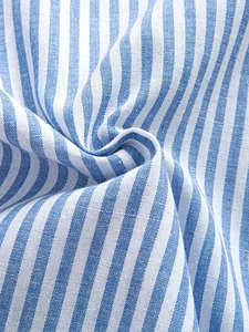 Detailed close-up of blue and white striped fabric texture for retro casual shirt