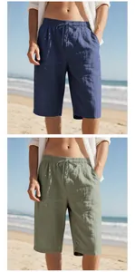 Detailed view of men's cotton linen beach shorts in navy and sage green colors.