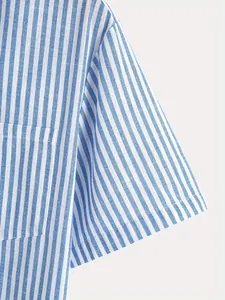 Close-up of blue and white vertical striped retro short-sleeve shirt sleeve and pocket detail