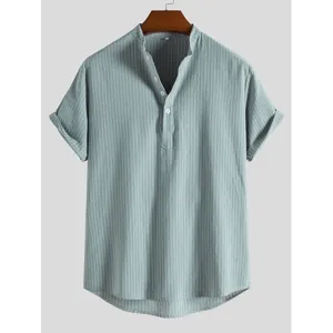 Detailed view of men's striped short sleeve shirt with cuffed sleeves and Henley neck