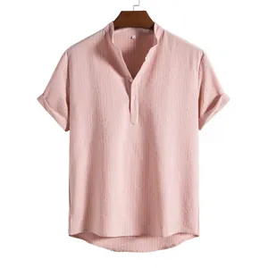 Detail shot of men's pink striped casual shirt with henley collar and soft fabric