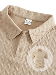 Close-up of men's beige polo shirt showing waffle texture and size label details.
