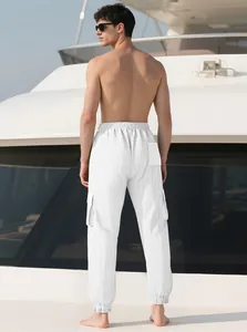 Rear view of white slim-fit cargo joggers for men featuring side pockets and textured fabric