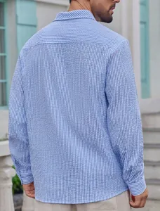 Back view detail of a men's blue and white striped seersucker shirt with a lapel collar