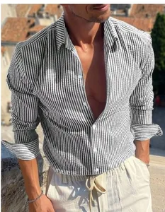 Detail view of men's black and white striped long-sleeve shirt with lapel collar.