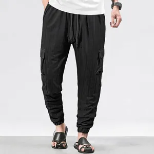 Men's slim fit black cargo joggers with multi-pocket design and tapered ankle cuffs