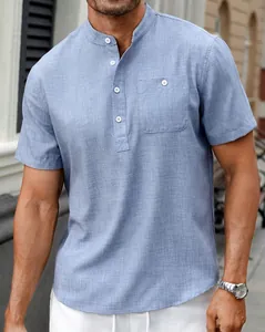 Detail view of a men's light blue Henley shirt with a standing collar and pocket
