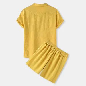 Detailed back view of men's summer two-piece yellow cotton shirt and shorts casual set
