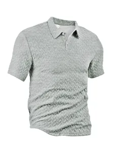 Close-up detail of light grey men's waffle jacquard polo shirt with textured pattern