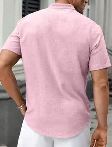 Back view of a men's light pink casual short sleeve shirt with a textured fabric