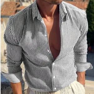 Stylish men's black and white vertical striped long-sleeve shirt with a classic lapel.