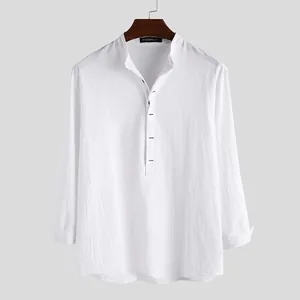 Detail of a white cotton linen henley shirt with a clean minimalist design.