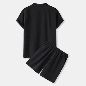 Back view of a black men's cotton short-sleeve shirt and shorts set with fine texture.