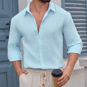 Men's light blue striped seersucker shirt with long sleeves and casual lapel collar