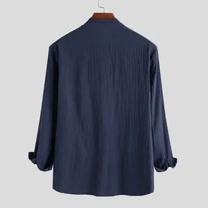 Back view of a casual navy blue cotton linen long-sleeved shirt for men on a hanger