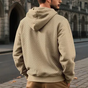 Men's tan geometric jacquard hooded sweatshirt shown from a back view outdoors
