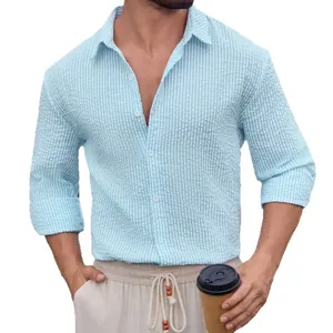 Fashionable men's light blue striped seersucker long sleeve shirt with classic lapel
