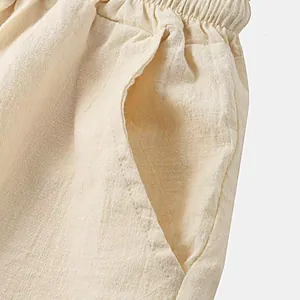 Close-up of side pocket and breathable cotton linen fabric texture on men's shorts