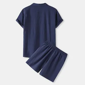 Back view of navy blue men's short-sleeve shirt and elastic waist shorts cotton set
